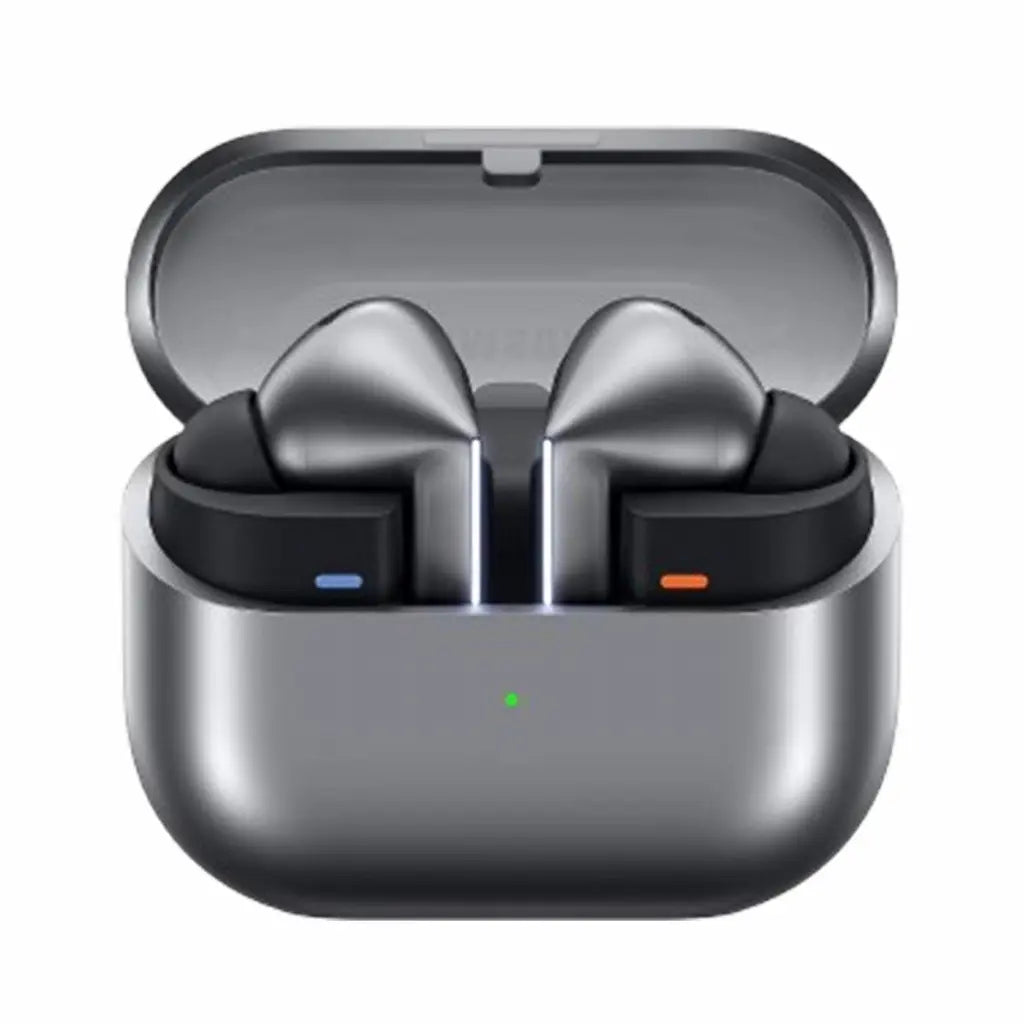 True wireless earbuds in an open charging case, shown on a plain white background. The earbuds are dark gray with black inner sections, and the case is metallic dark gray with a small green indicator light.