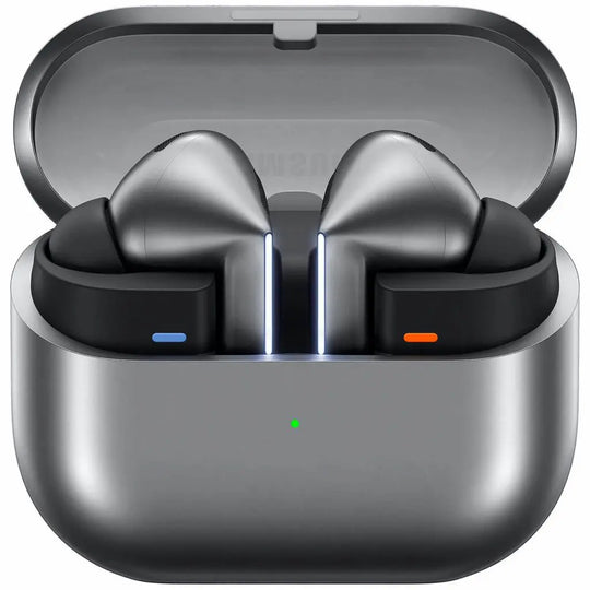 True wireless earbuds in a metallic gray charging case, shown open on a plain white background. The earbuds are black with metallic gray tips, and the case has small blue, orange, and green indicator lights.